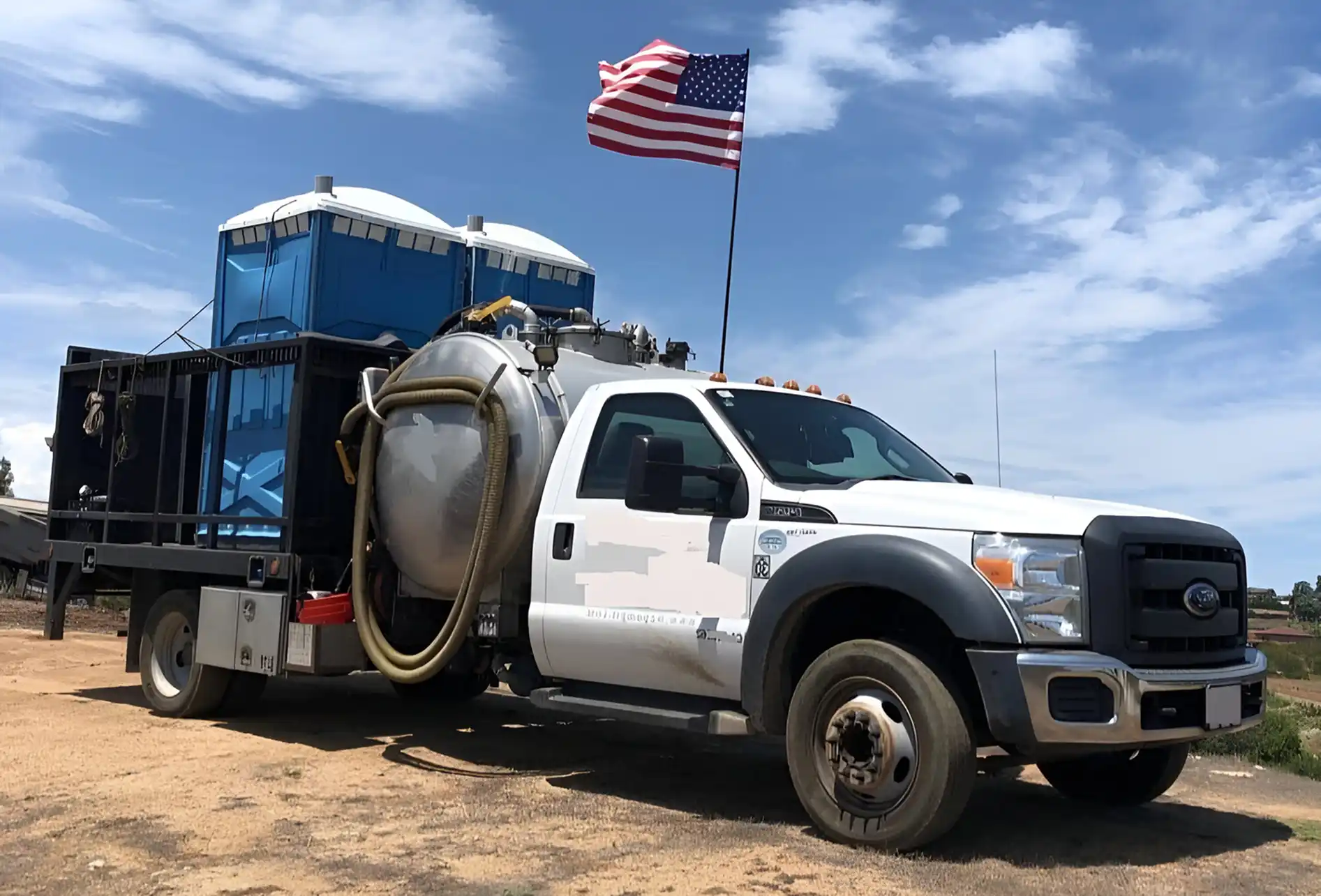 Professional porta potty rental unit at construction site - FlushJohn portable toilets